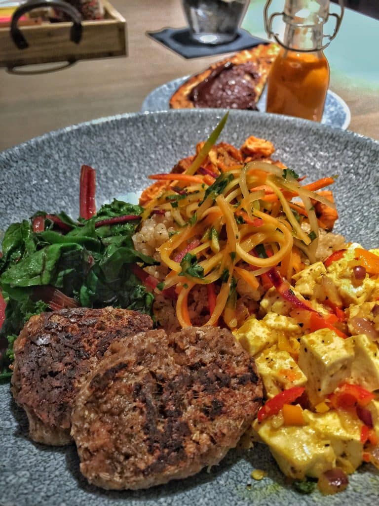 Breakfast Protein Bowl Choice of Tofu Scramble or Eggs with Quinoa, Sweet Potatoes, Chard and Kale, Vegan Sausage, Chocolate-Avocado Toast, and Carrot-Ginger Dressing