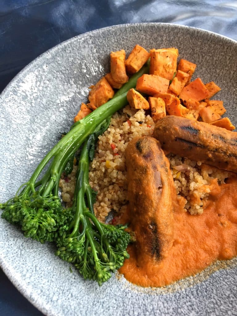 Vegan Protein Bowl Vegan Italian Sausage, Quinoa, Sweet Potatoes, and Broccolini with Roasted Cherry Tomato Sauce